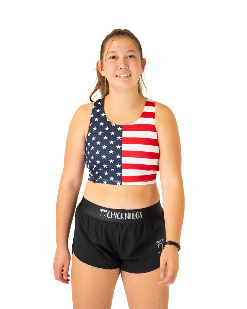 Front view of ChicknLegs Women's PWR Crop Top featuring lightweight performance fabric, unlined and unpadded design and a cropped fit that sits above the natural waist.