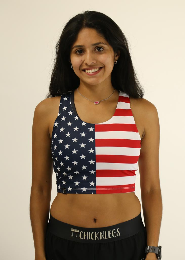 Front view of runner wearing the USA PWR Crop Top.