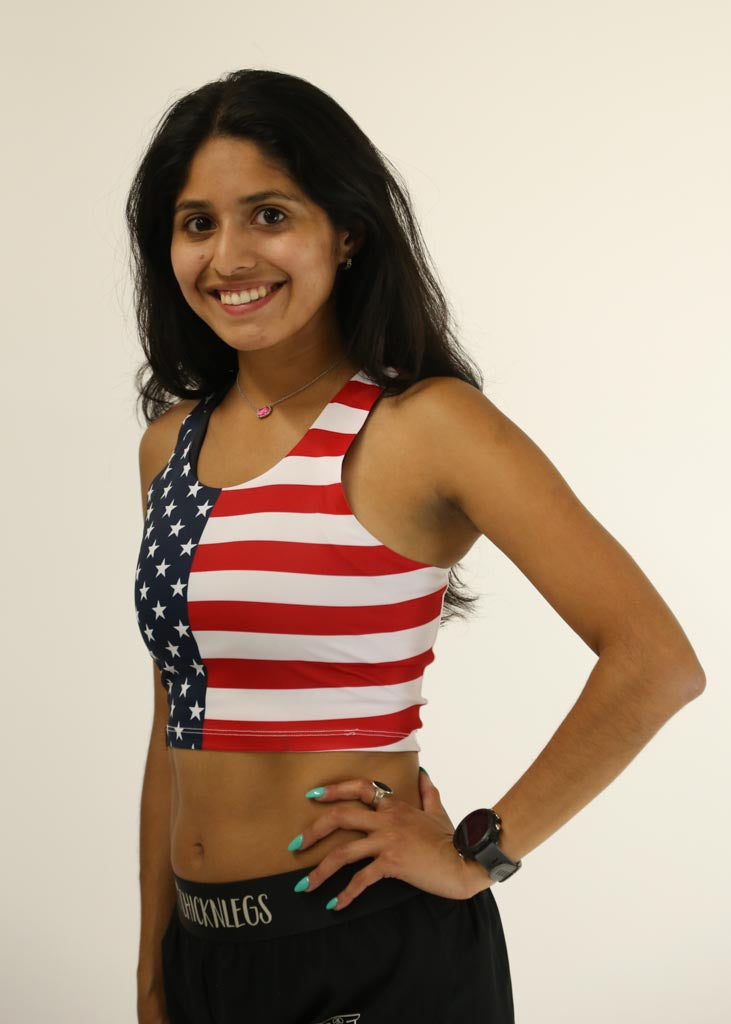 Side view of runner wearing the USA PWR Crop Top from ChicknLegs.
