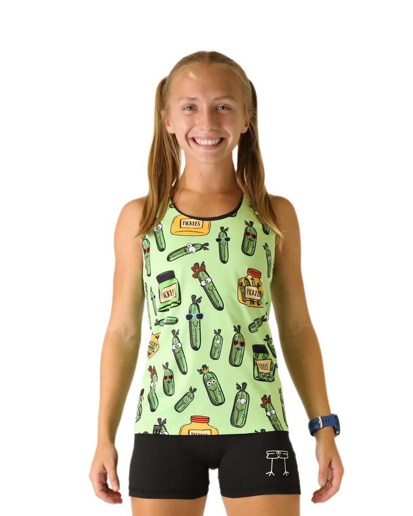 Runner is wearing ChicknLegs in the women's performance running singlet in the pickles design. The print has a bunch of pickles all over it and in jars that are yellow and green.