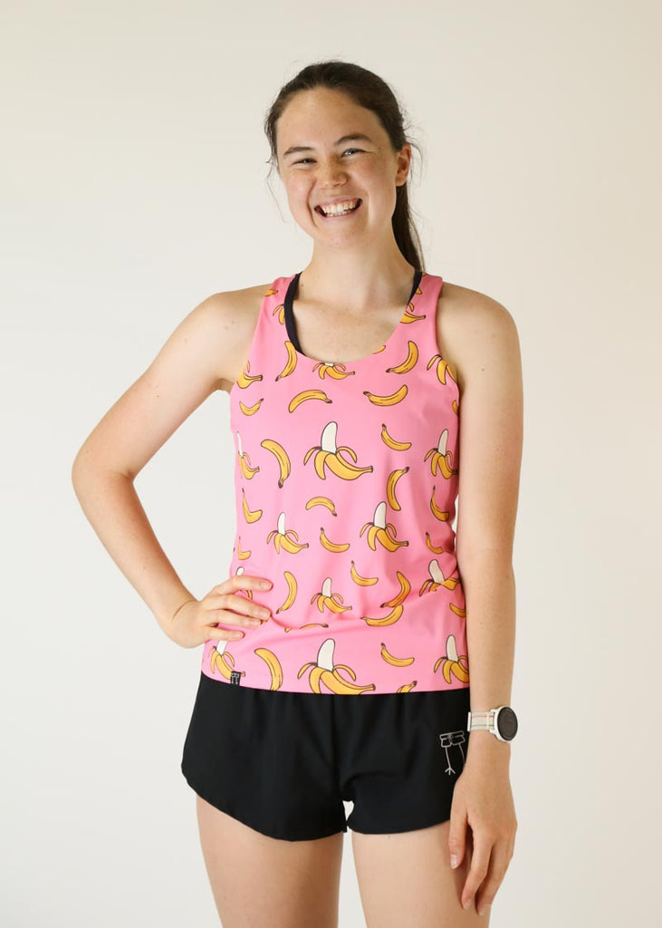 Front view of the women's pink bananas performance running singlet from ChicknLegs.