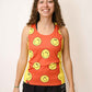 Front view of the women's running singlet with our smiley face design.
