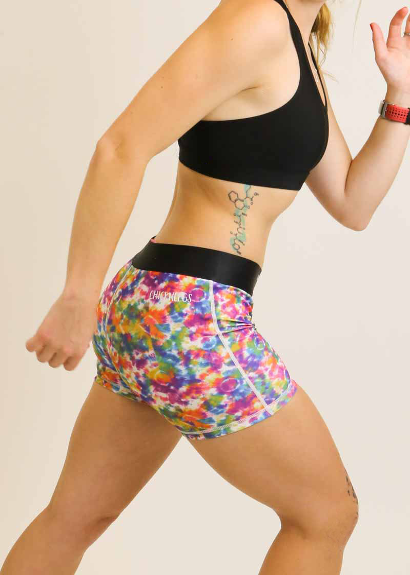 Side profile view of the ChicknLegs Tie-Dye 3 inch compression running shorts.