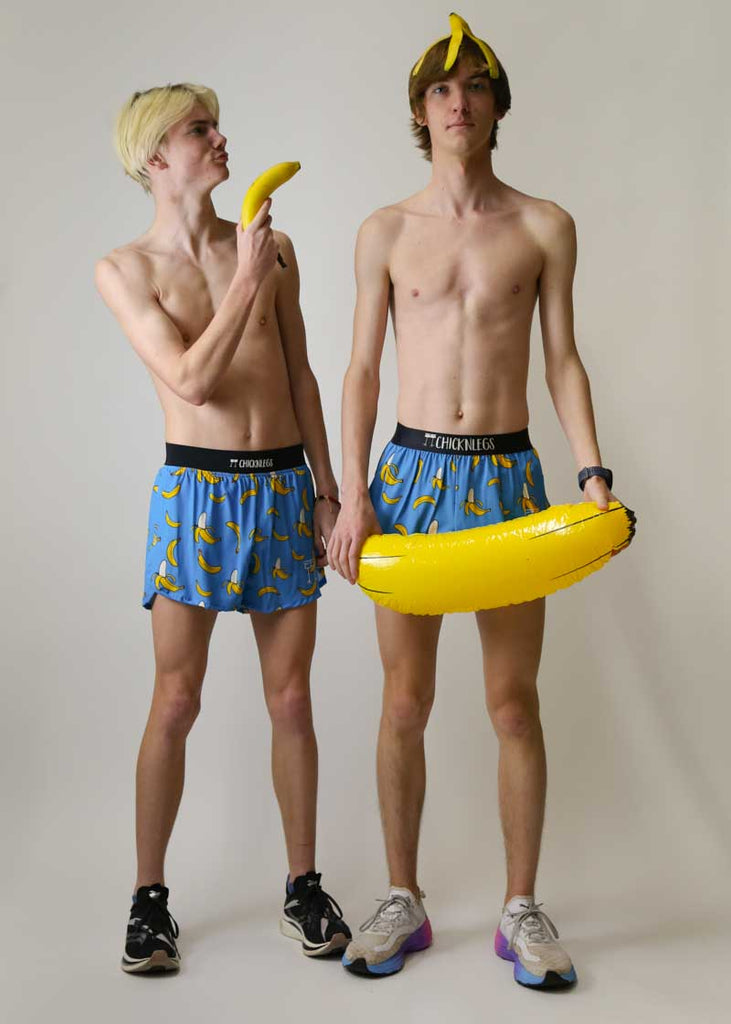 Runner with bananas on his head while wearing the blue bananas running shorts.