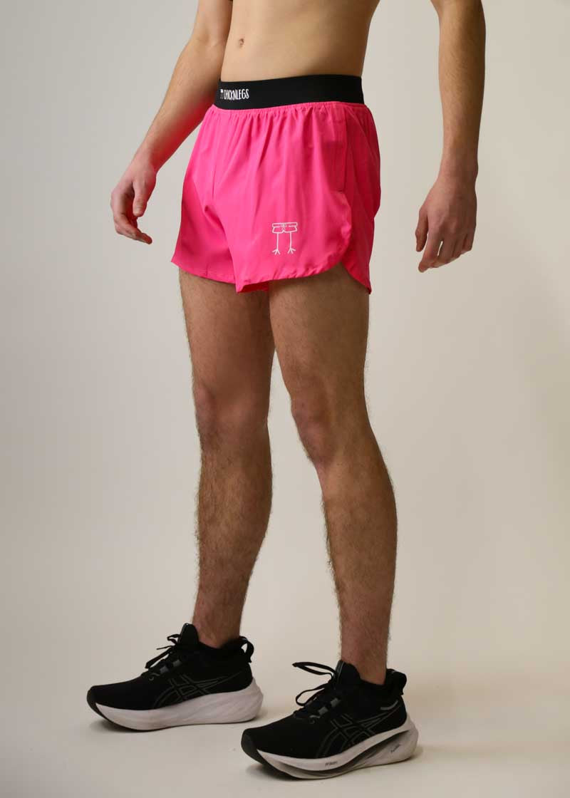 Side view of men's 4 inch neon pink running shorts.