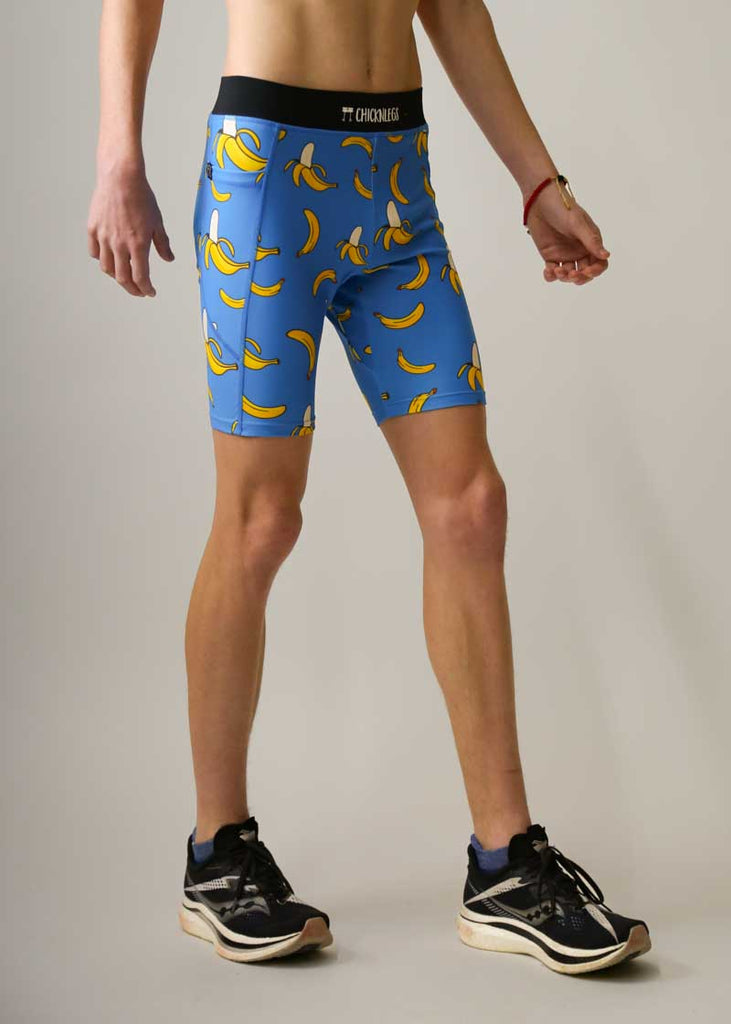 Side view of the men's 8 inch half tights in our blue bananas design.