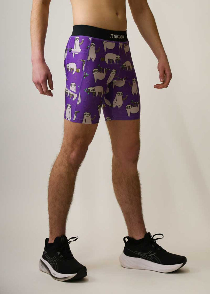 Side view of the men's 8 inch half tights in the purple sloths design.