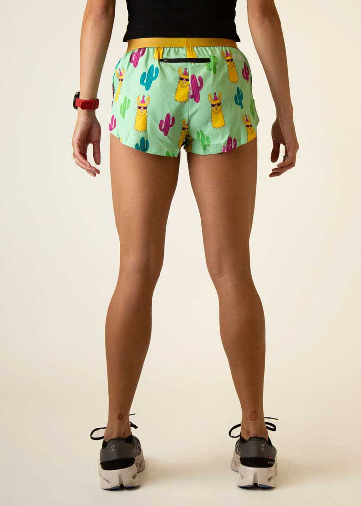 Rear view of the women's green llamas 1.5  inch running shorts.