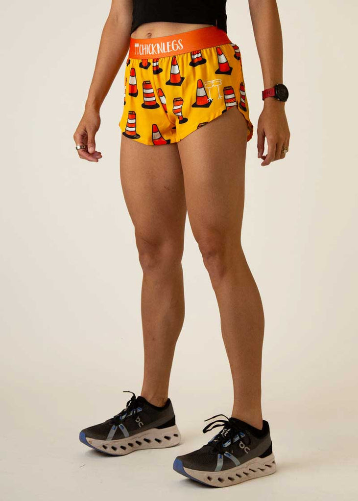 Left side view of the women's traffic cones  1.5 inch running shorts.