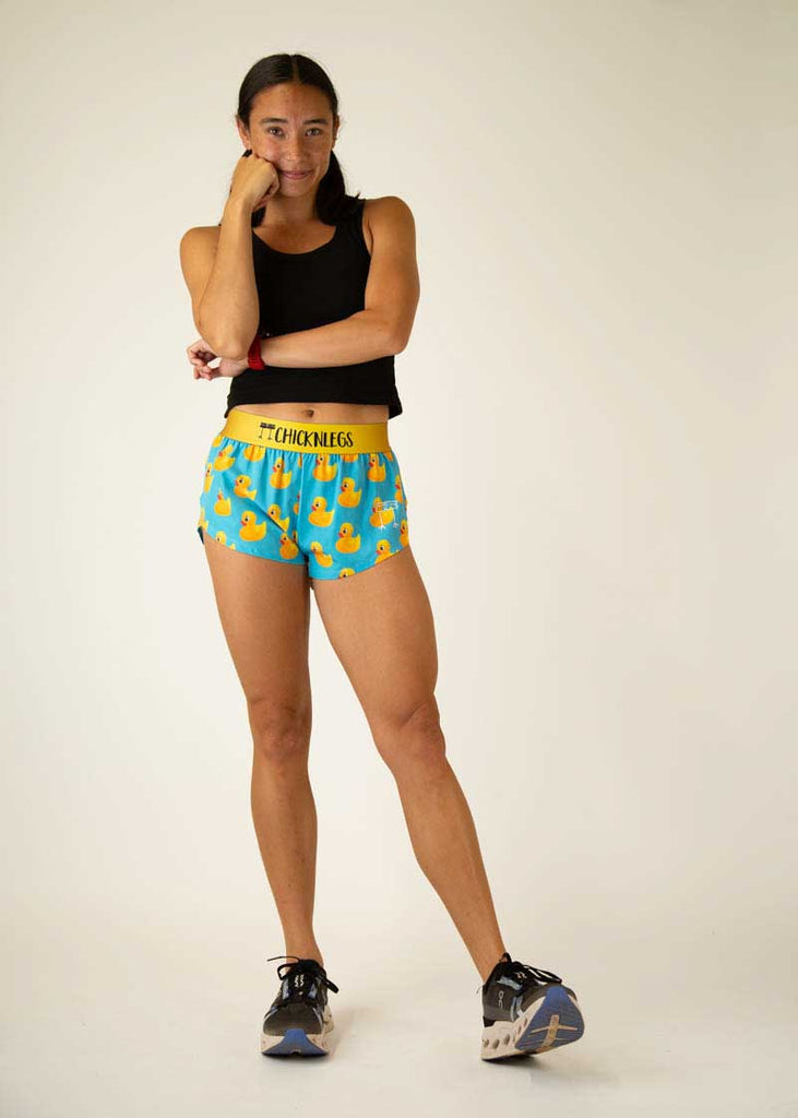 Full body view of the women's rubber ducky 1.5 inch split running shorts.