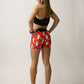 Runner looking over her shoulder while wearing the women's 3" burrito compression shorts.