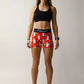 Full body view of the women's compression running shorts in our red burrito design.