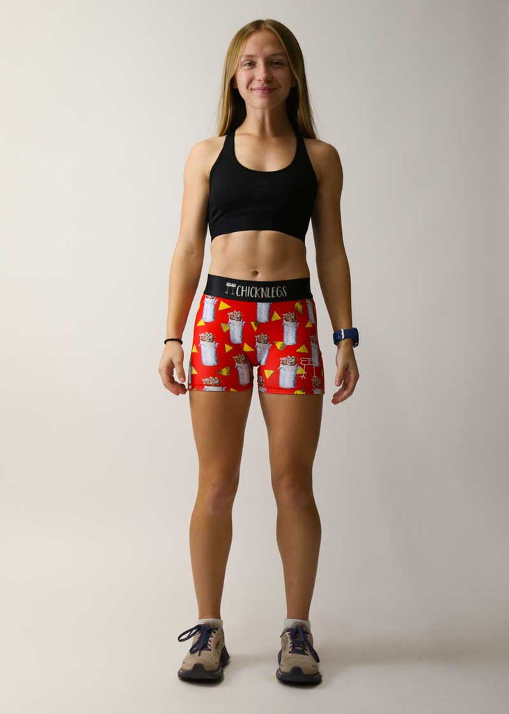 Full body view of the women's compression running shorts in our red burrito design.