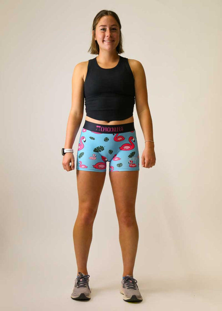 Full body shot of the women's blue flamingo compression running shorts.