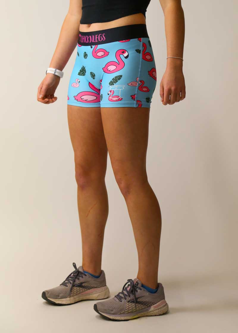 Closeup side view of the women's 3 inch blue flamingo compression shorts.
