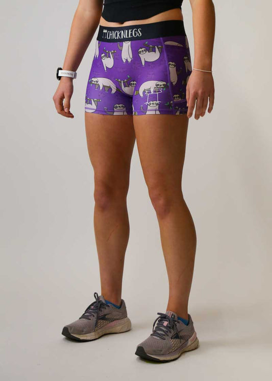 Side view of the women's compression spandex shorts with the purple sloth design.