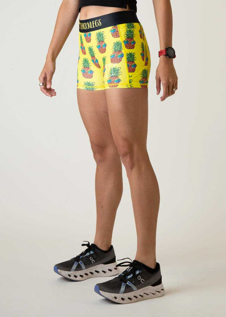 Left side view of the women's 3 inch pineapple express compression running shorts from ChicknLegs.