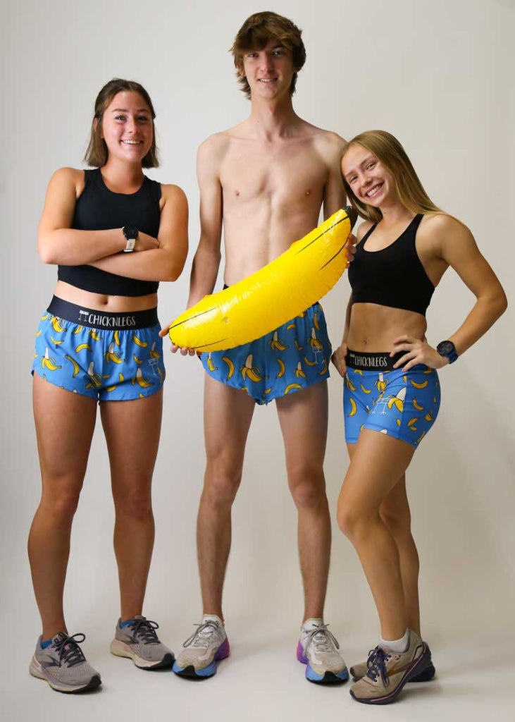 Runners wearing the men's and women's blue bananas running shorts.