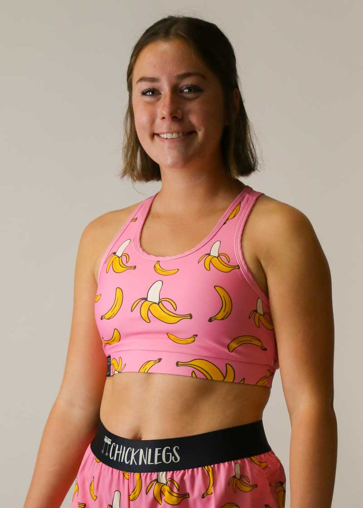 Side view of the ChicknLegs OG sports bra in our pink bananas design.