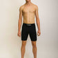 Full body view of runner wearing the men's 8 inch black half tights.