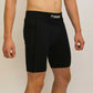 Side view of the men's 8 inch black half tights.