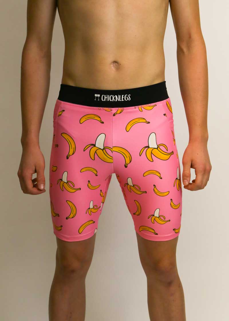 Front view of the men's 8 inch pink bananas half tights.