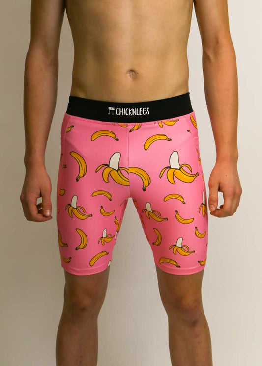 Front view of the men's 8 inch pink bananas half tights.