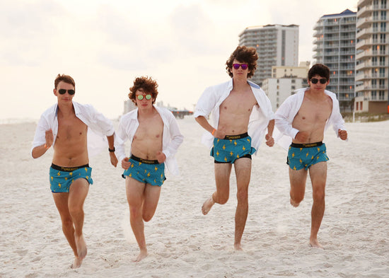 The boys cross country team wearing ChicknLegs blue bolts matching running shorts.