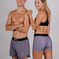 Group picture of the heather grey design in both the women's 3 inch compression shorts and the men's 4 inch half split running shorts.
