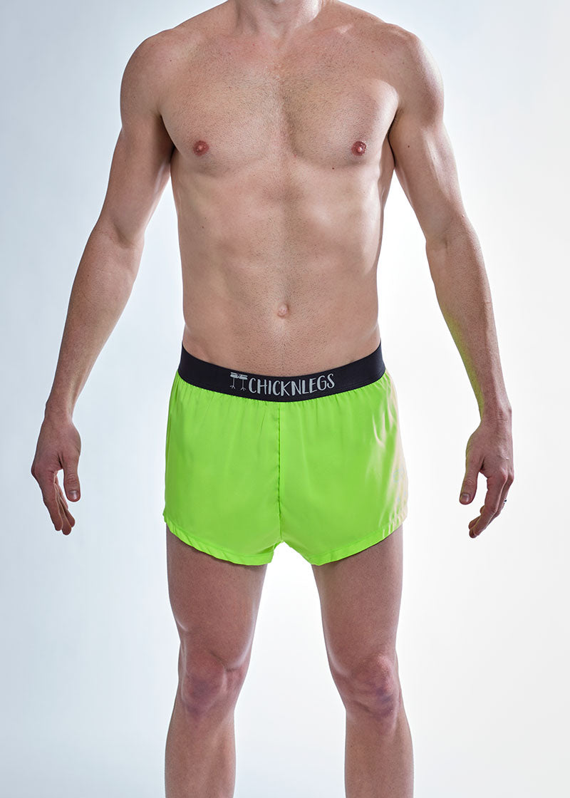 Front closeup view of the ChicknLegs men's 2 inch neon green split running shorts.