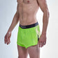 Side logo view of the ChicknLegs men's 2 inch neon green split running shorts.