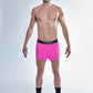 Full body view of the men's neon pink 2 inch split running shorts.
