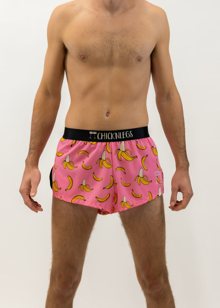 Front view of the men's pink bananas 2 inch split running shorts from ChicknLegs.