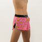 Side view of the men's pink bananas 2 inch split running shorts from ChicknLegs.