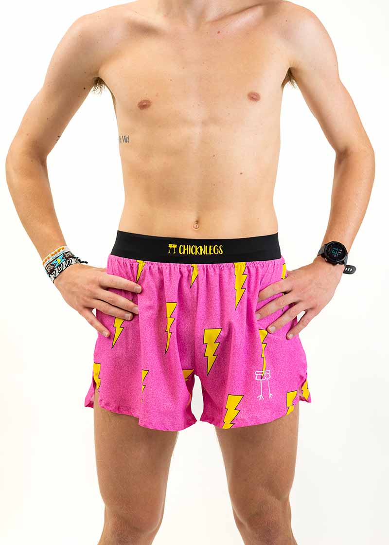 Front view of the men's 4 inch pink bolts running shorts from ChicknLegs.