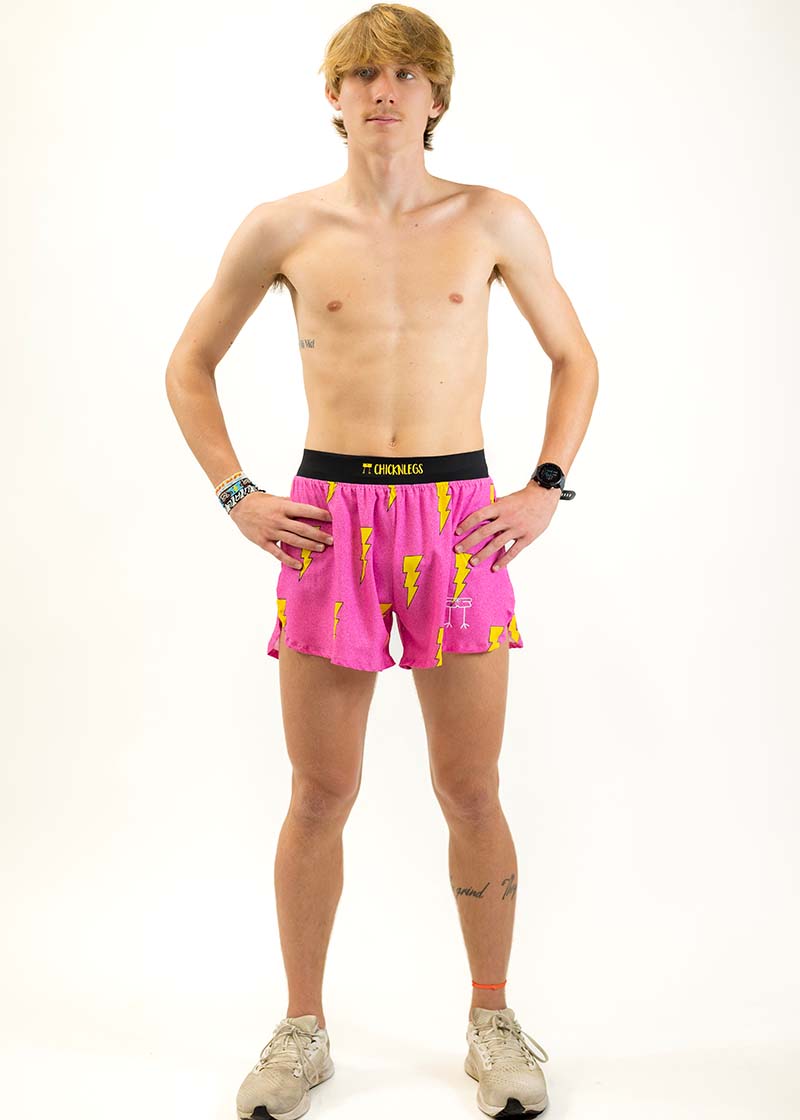 Full body view of the men's 4 inch pink bolts running shorts from ChicknLegs.