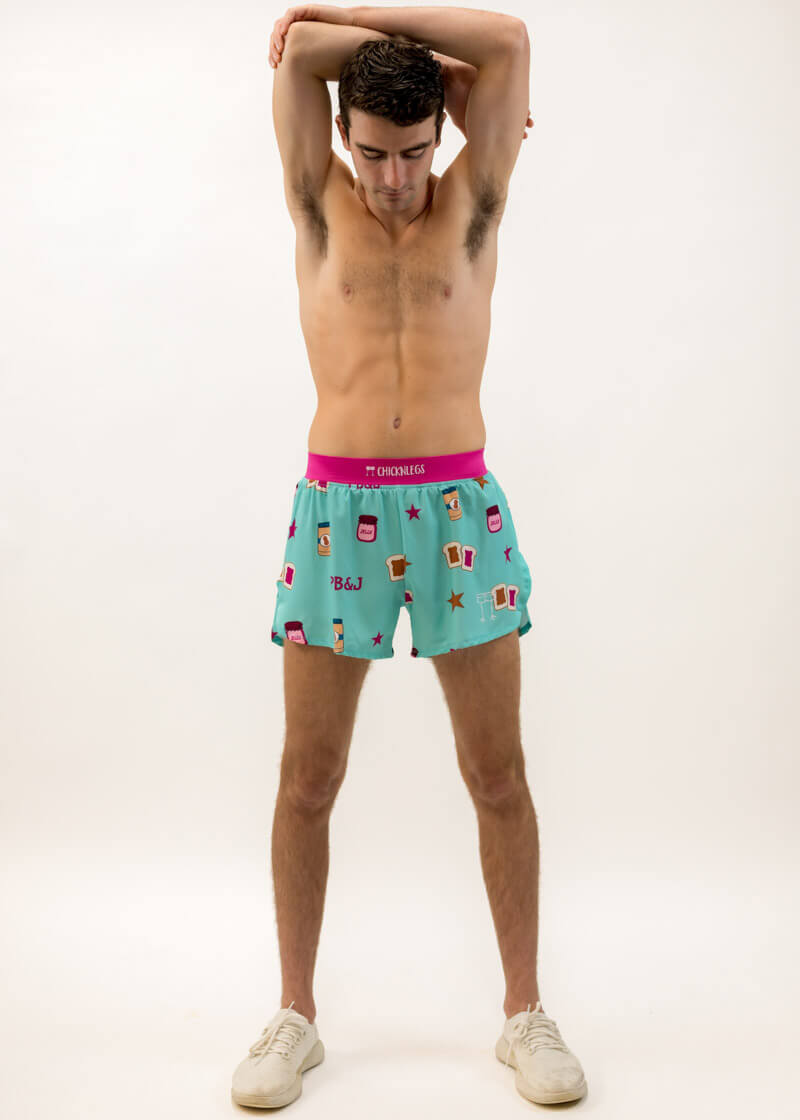 Runner stretching while wearing the men's PB&J 4 inch running shorts from ChicknLegs.