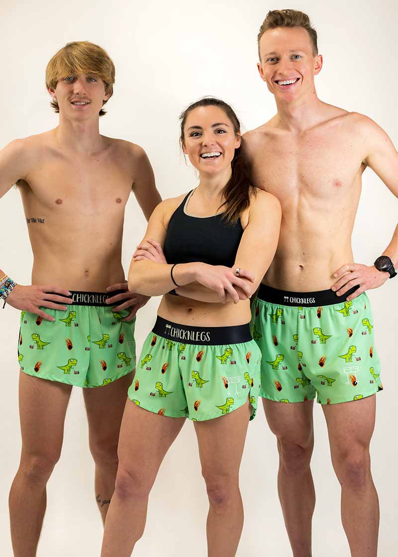 Group photo of the men's and women's dino running shorts from ChicknLegs.