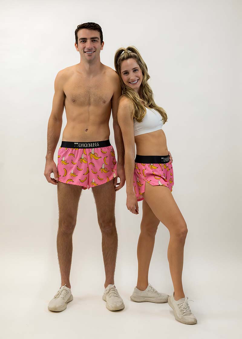 Group shot of the men's and women's pink bananas running shorts.