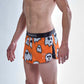 Side logo view of the ChicknLegs men's 2 inch ghosts split running shorts.