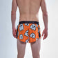 Rear view of the ChicknLegs men's 2 inch ghosts split running shorts.