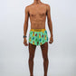 Full body shot of the men's 2 inch green llama running shorts.