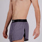 Logo side closeup view of the ChicknLegs men's heather grey 2 inch split running shorts.