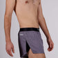 Side closeup view of the ChicknLegs men's heather grey 2 inch split running shorts.