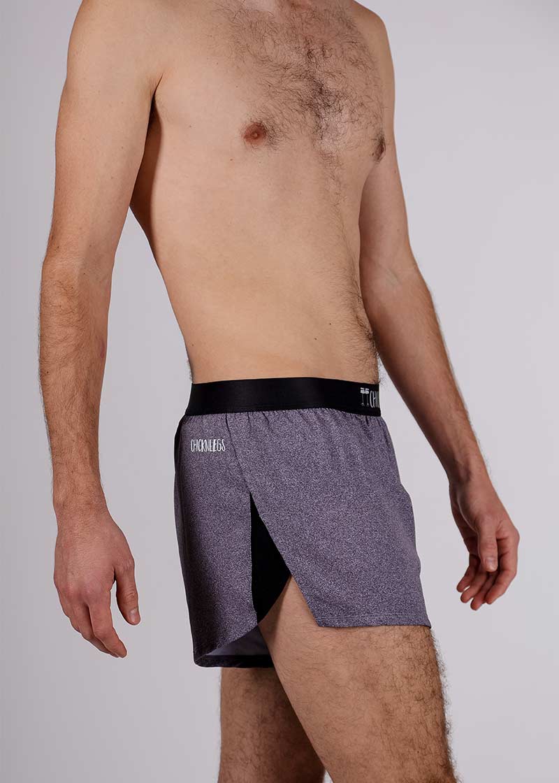 Side closeup view of the ChicknLegs men's heather grey 2 inch split running shorts.