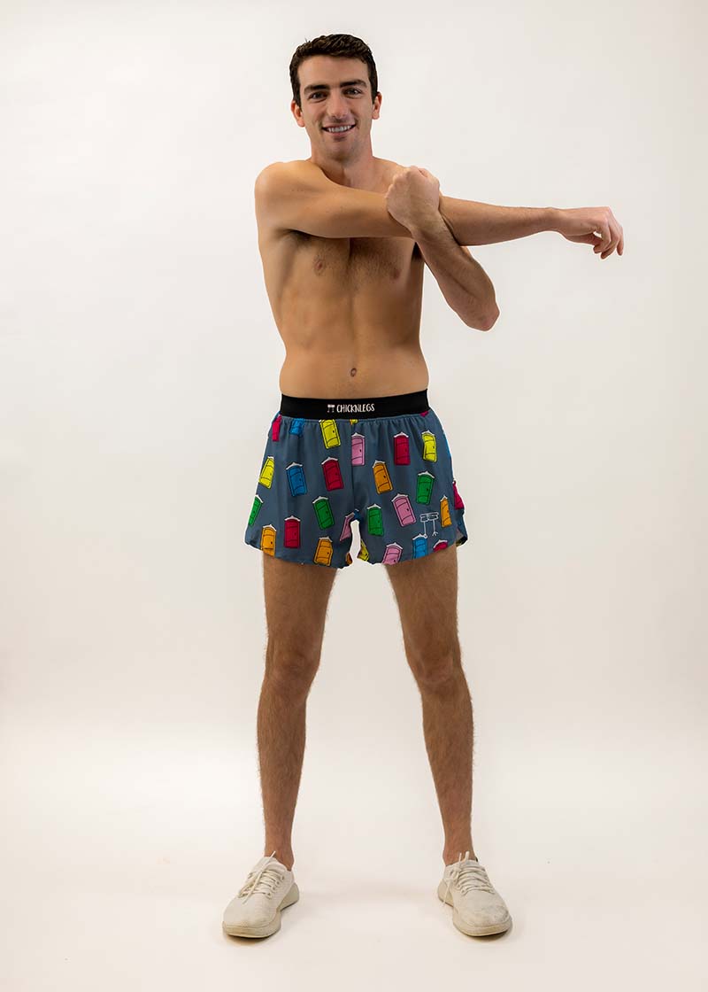 Runner stretching while wearing the men's 4 inch porta potty running shorts from ChicknLegs.