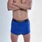 Front closeup view of the chicknlegs men's 2 inch royal blue split running shorts.