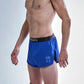Side logo view of the chicknlegs men's 2 inch royal blue split running shorts.