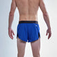 Rear view of the chicknlegs men's 2 inch royal blue split running shorts.
