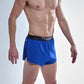 Side split closeup view of the chicknlegs men's 2 inch royal blue split running shorts.